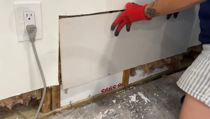 Install the new drywall piece, ensuring it's secured to a stud.
