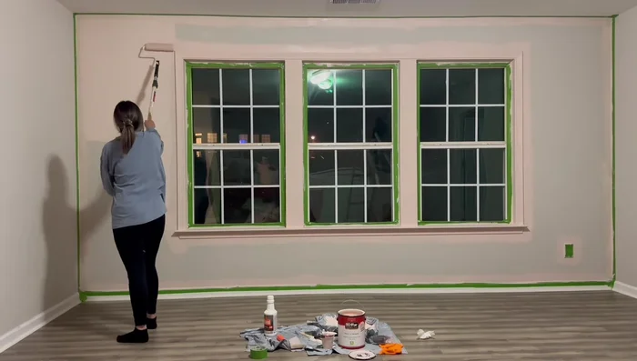 Creating scallop detail on accent wall using a lid as a template and hand-painting with an eyeshadow brush