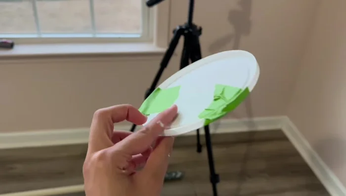 Creating scallop detail on accent wall using a lid as a template and hand-painting with an eyeshadow brush