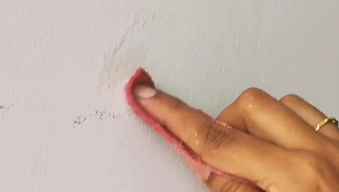 Rub the area with a plain wet cloth to remove the soap residue.