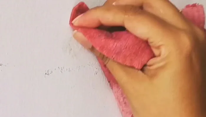 Rub the area with a plain wet cloth to remove the soap residue.