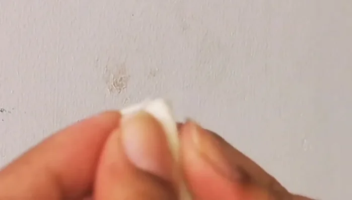 Immediately rub the area with a rubber eraser to lift off the remaining sticky material. The sticky residue will come off with the rubber.