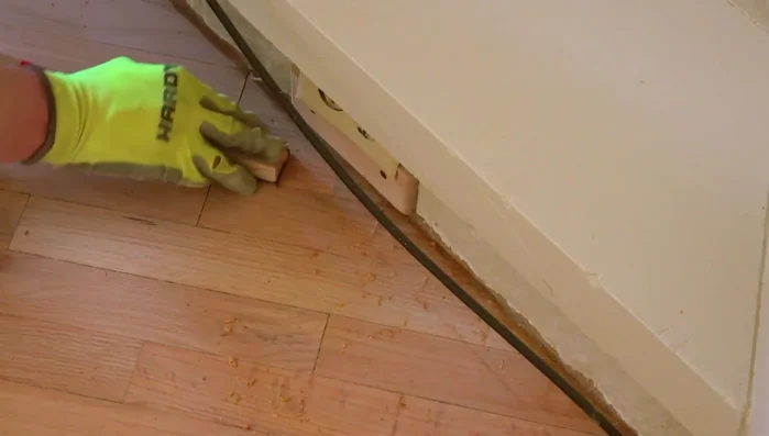 Scraping: Use a scraper to address corners and hard-to-reach areas.