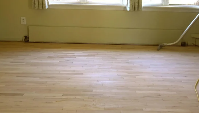 Vacuuming: Thoroughly vacuum the floor with a powerful vacuum featuring a felt or horsehair head to remove all sanding dust.