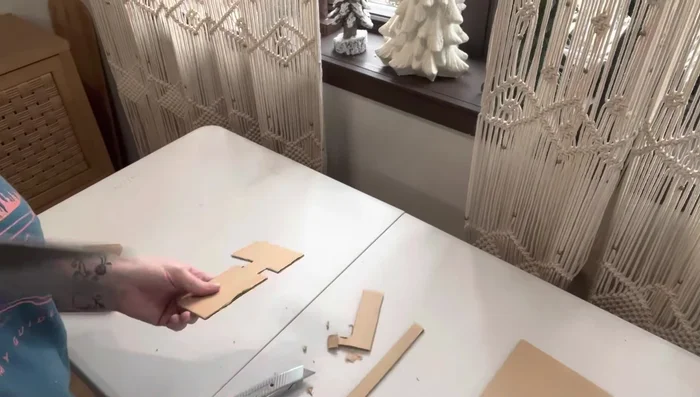 Add finishing touches (optional): Attach decorative elements such as door handles, keys, a light switch, and a doormat.