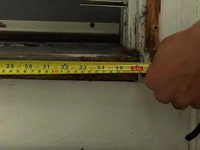 Remove the old threshold pieces using a pry bar. You may need to split the center section.
