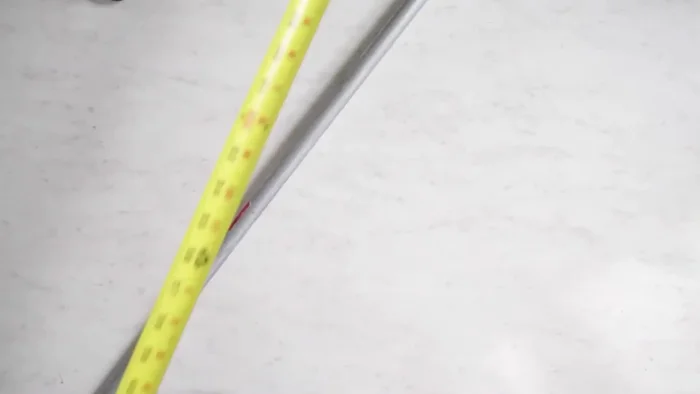 Mark the measurement on your metal conduit and cut it using a pipe cutter.