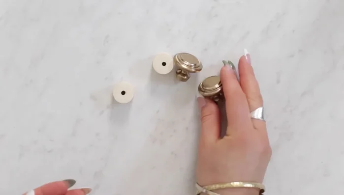 Attach decorative knobs to the PVC end pieces using heavy-duty glue (or by sanding down the PVC's inside for a sliding fit).