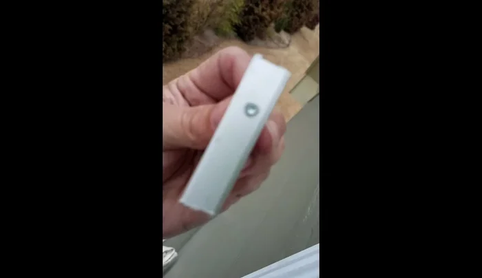 Apply double-sided tape to the back of the aluminum patch.