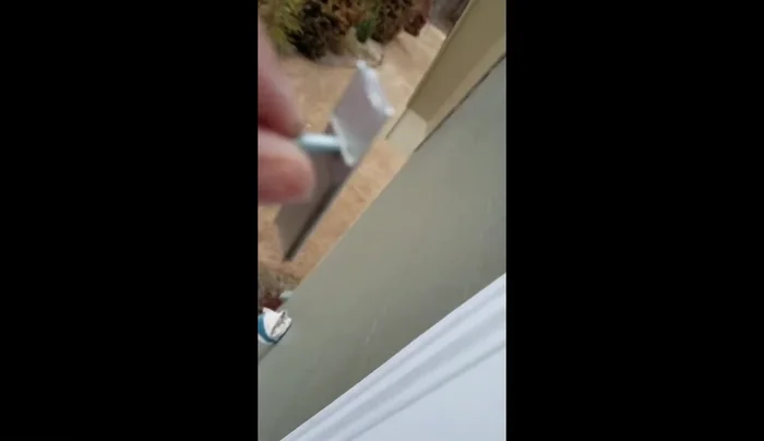 Apply double-sided tape to the back of the aluminum patch.