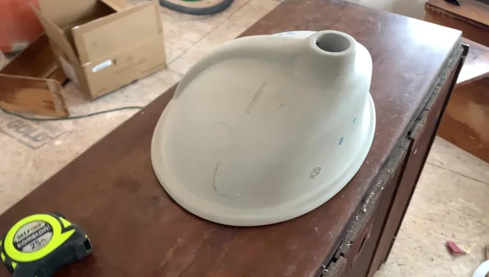 Sand the dresser top to remove imperfections.