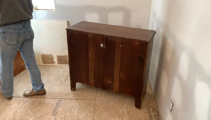 Sand the dresser top to remove imperfections.