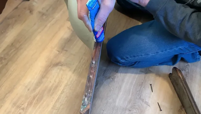 Set the dresser top in place and attach it with screws. Install new drawer hardware.