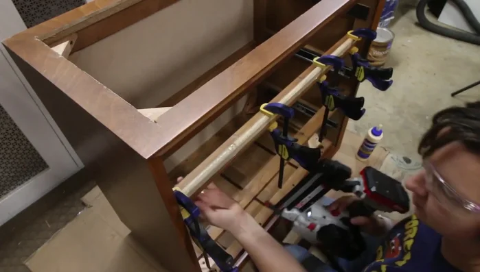 Shorten the drawer knobs using electrician's pliers to fit the modified drawer.