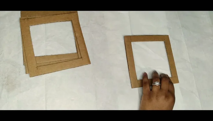 Cut cardboard into 6x6 squares.