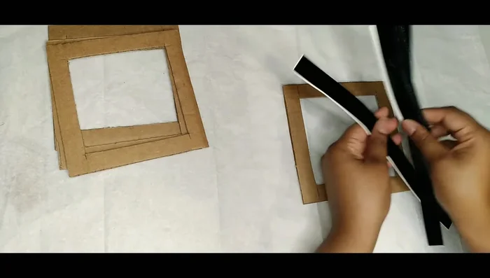 Cut self-adhesive vinyl into 1-inch strips.