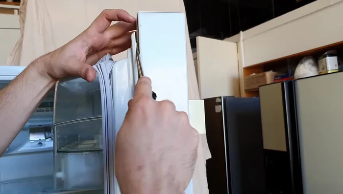 Tuck the lip of the new seal securely behind the door liner all the way around.