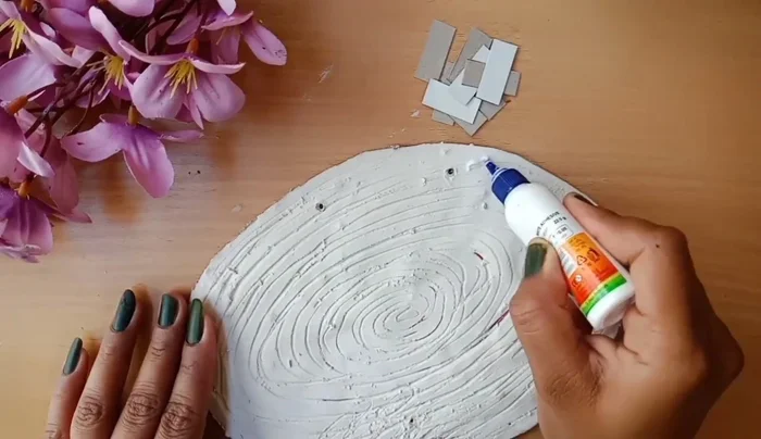 Cut and stick rectangle pieces of thick board to the base.