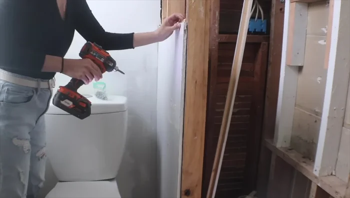 Install plywood on the closet's interior. Cut plywood into sections if necessary due to wall irregularities.