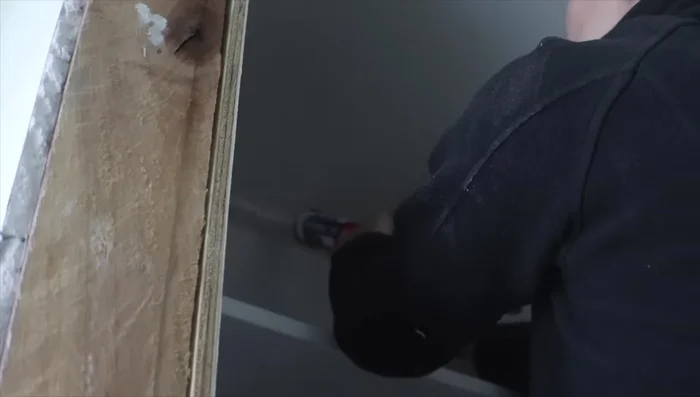 Caulk all seams and touch up paint. Add baseboards and additional hooks or baskets as desired.