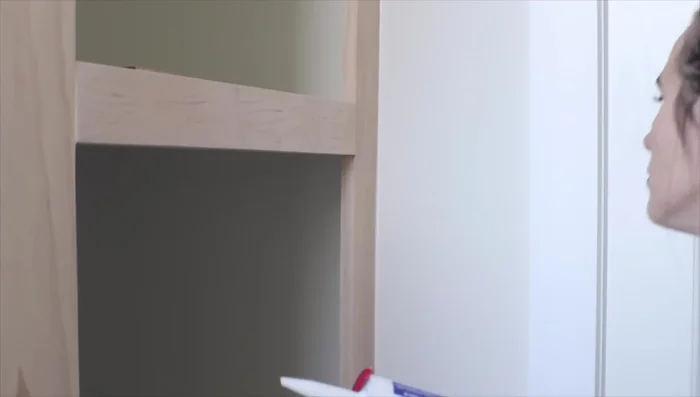 Caulk all seams and touch up paint. Add baseboards and additional hooks or baskets as desired.