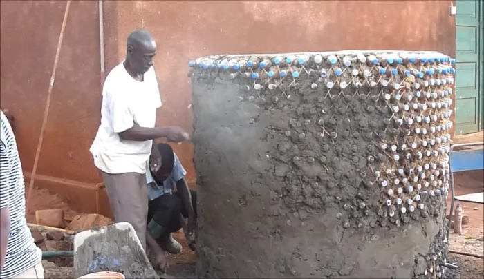 Apply a 1cm thick plaster layer (inside and outside) using a 5:1 sand-to-cement ratio, waterproof cement, and lime.