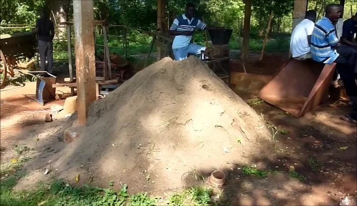 Sift river sand to remove silt, rocks, and sticks.