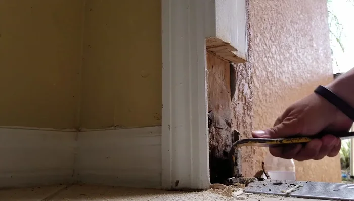 Clean out the rotted wood, chipping away until you reach solid, hard wood.