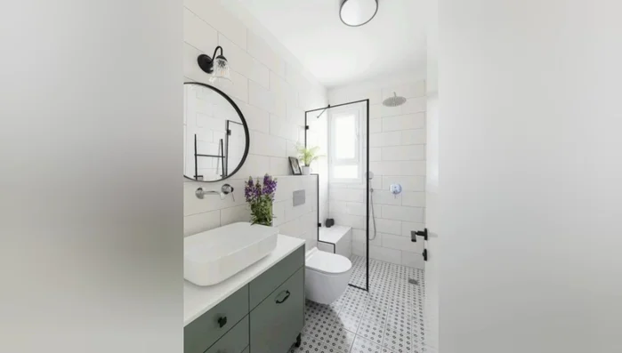 Add a mosaic tile backsplash behind the sink or bathtub.