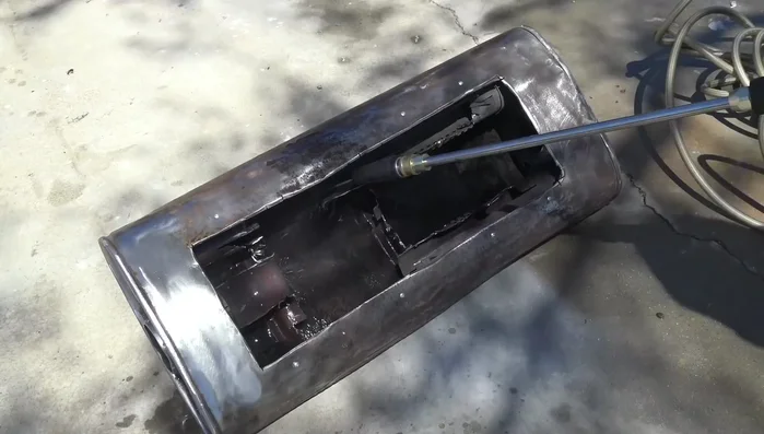 Clean the metal thoroughly using a pressure washer.