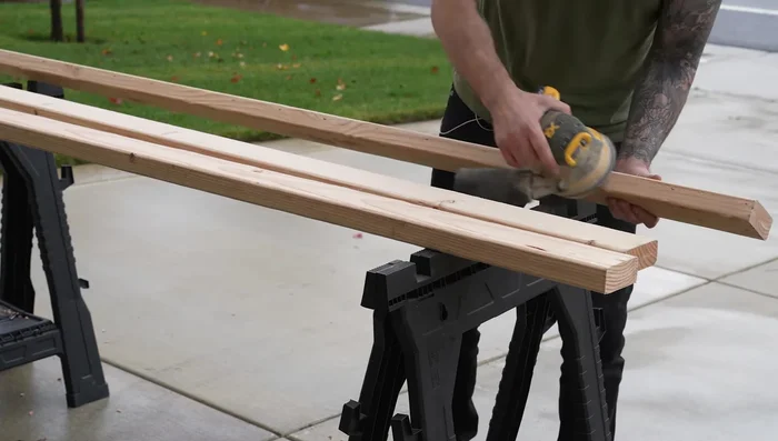 Paint all wood pieces with two coats of satin black paint.