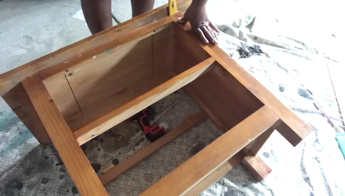 Remove the top of the dresser.