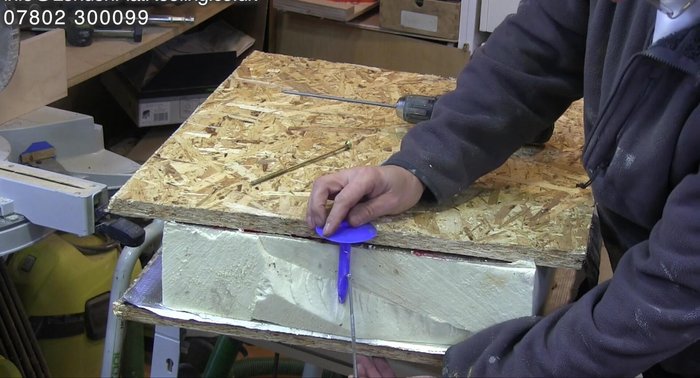 Inspecting the firmly broken fixings for proper installation.