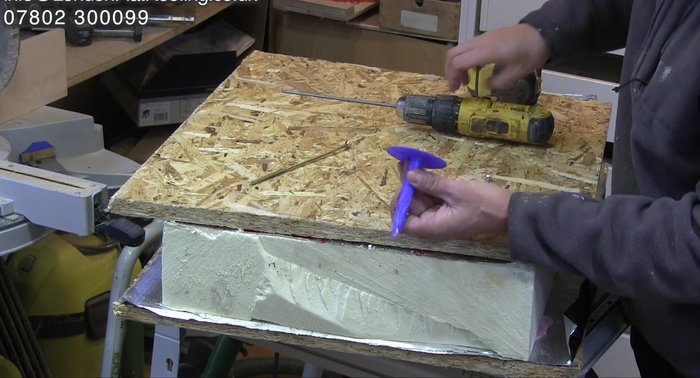 Inspecting the firmly broken fixings for proper installation.