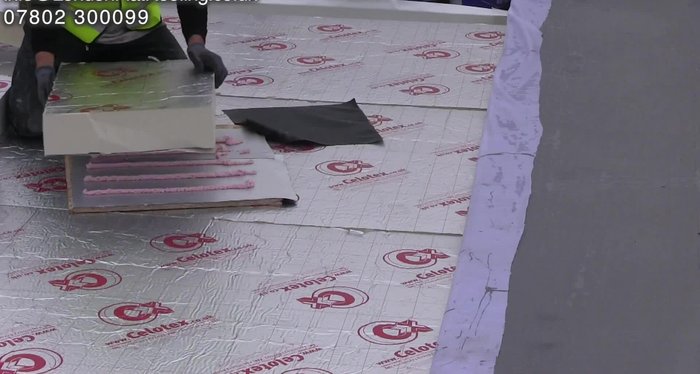 Showing examples of problems with gluing insulation, where the foil has separated from the backing.