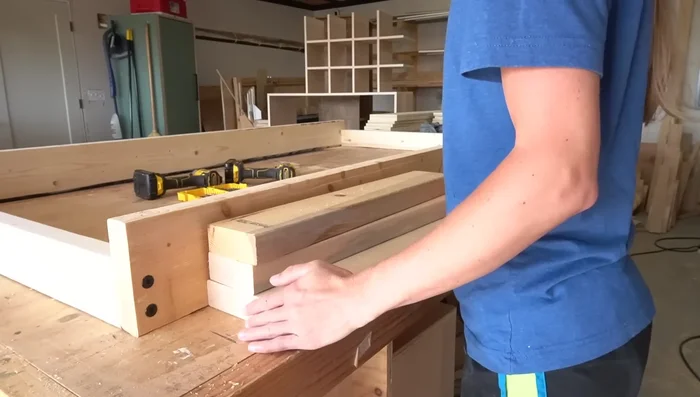 Add bottom supports (2x4s) using pocket holes and screws (or alternative methods).