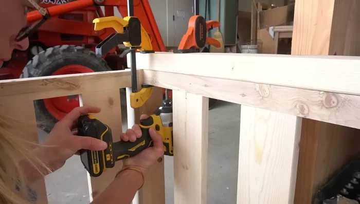 Trim the sides with 1x6 boards to match the thickness of the front and hide screw heads.