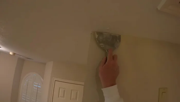 Feather the edges: Use your knife to create smooth, feathered edges by blending the repair into the existing wall (161.12).