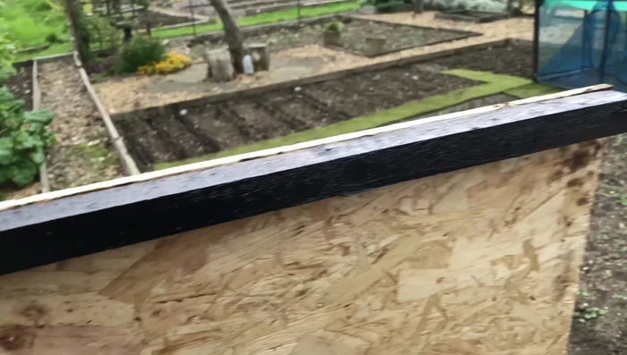 Reattach the new wood to the shed frame using significantly more screws than before (approximately 20).