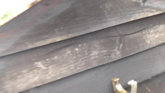 Reattach the new wood to the shed frame using significantly more screws than before (approximately 20).