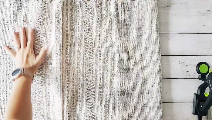 Flip the glued rugs right side out. Create a faux seam by folding a small crease at the corners and gluing it to create the illusion of a sewn seam.