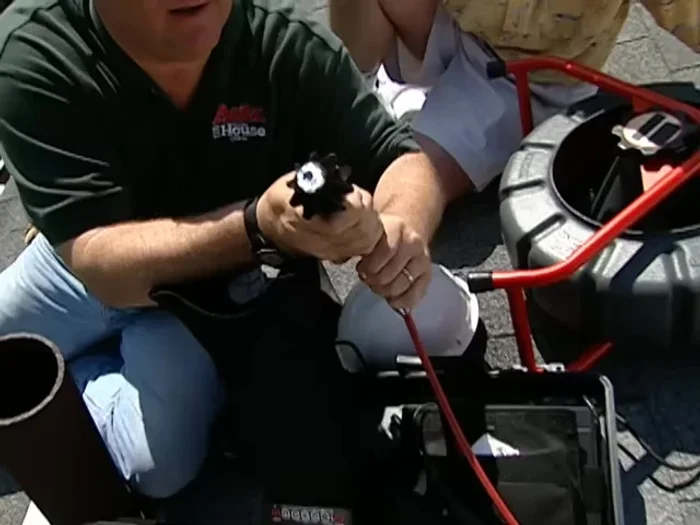 Use an electrician's probe to determine the clog's consistency.