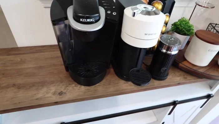 Position coffee machines (Nespresso Virtuo, Keurig, milk frother).