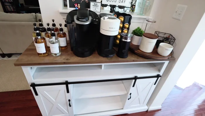 Arrange syrup bottles on the top shelf.