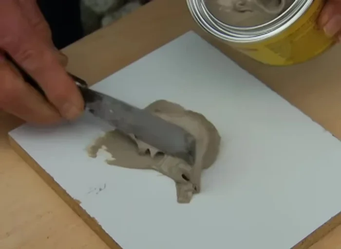 Remove masking tape once resin begins to set; remove high spots with chisel.