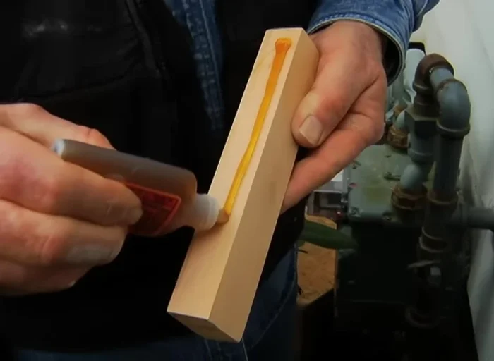 Replace outer portion of the sill with a cedar block, secured with polyurethane adhesive and nails. Shape to match existing sill profile and sand.