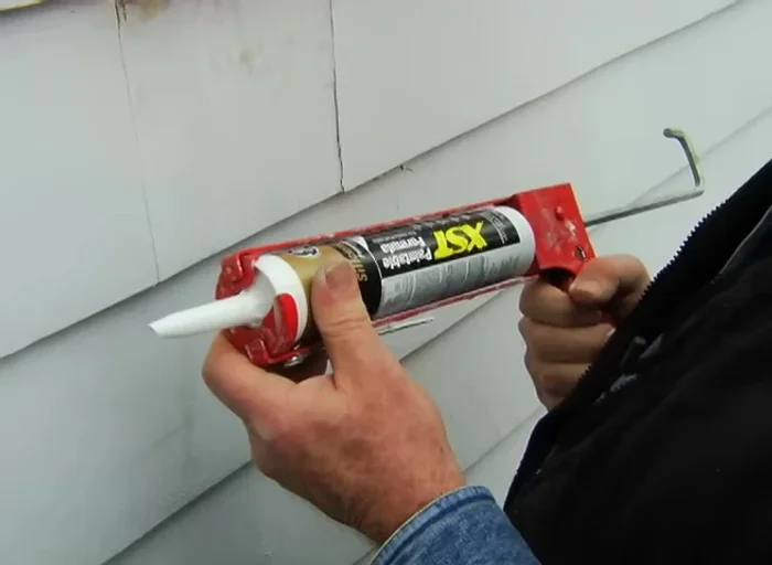 Sand, caulk seams, fill nail holes with spackle, and paint.