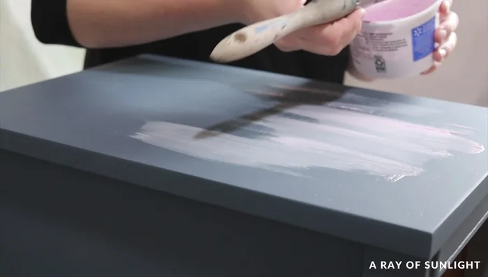 Fill wood grain, caulk seams, and sand smooth.