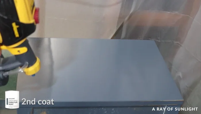 Apply two or three more coats of paint, sanding lightly between coats if necessary.