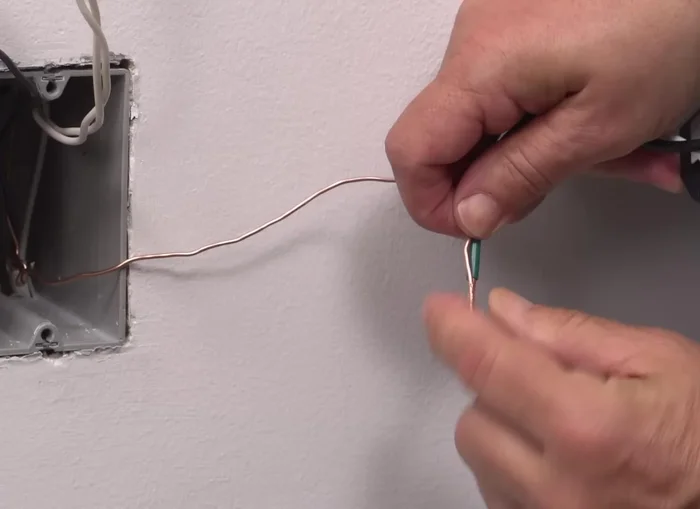 Connect the neutral wallbox wire to the white lead using a wire connector.